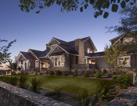 Craftsman-style residence with natural stone and timber details